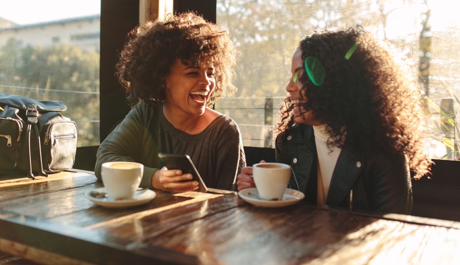 Two women connecting over coffee